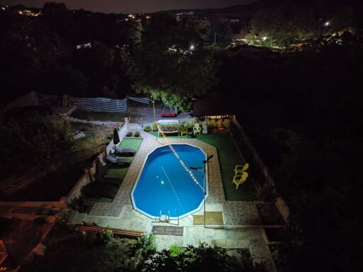backyard with pool at night